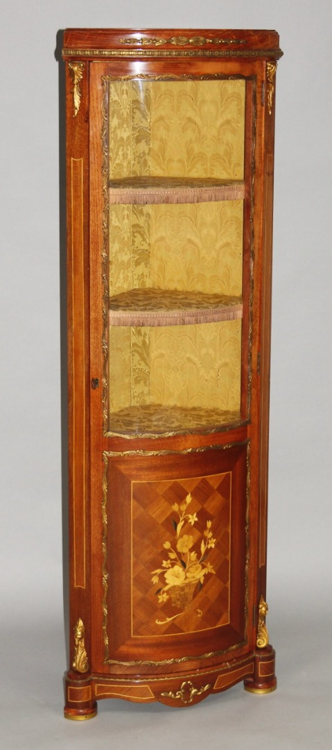 Appraisal: A Louis XV style corner cupboard with gilt metal mounts