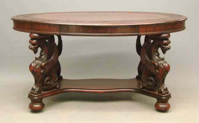 Appraisal: th c Victorian oval carved top mahogany winged griffin base