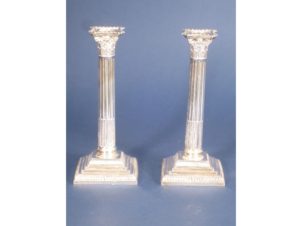 Appraisal: Pair of Victorian Pillar Candlesticks with corinthian capitals step fluted