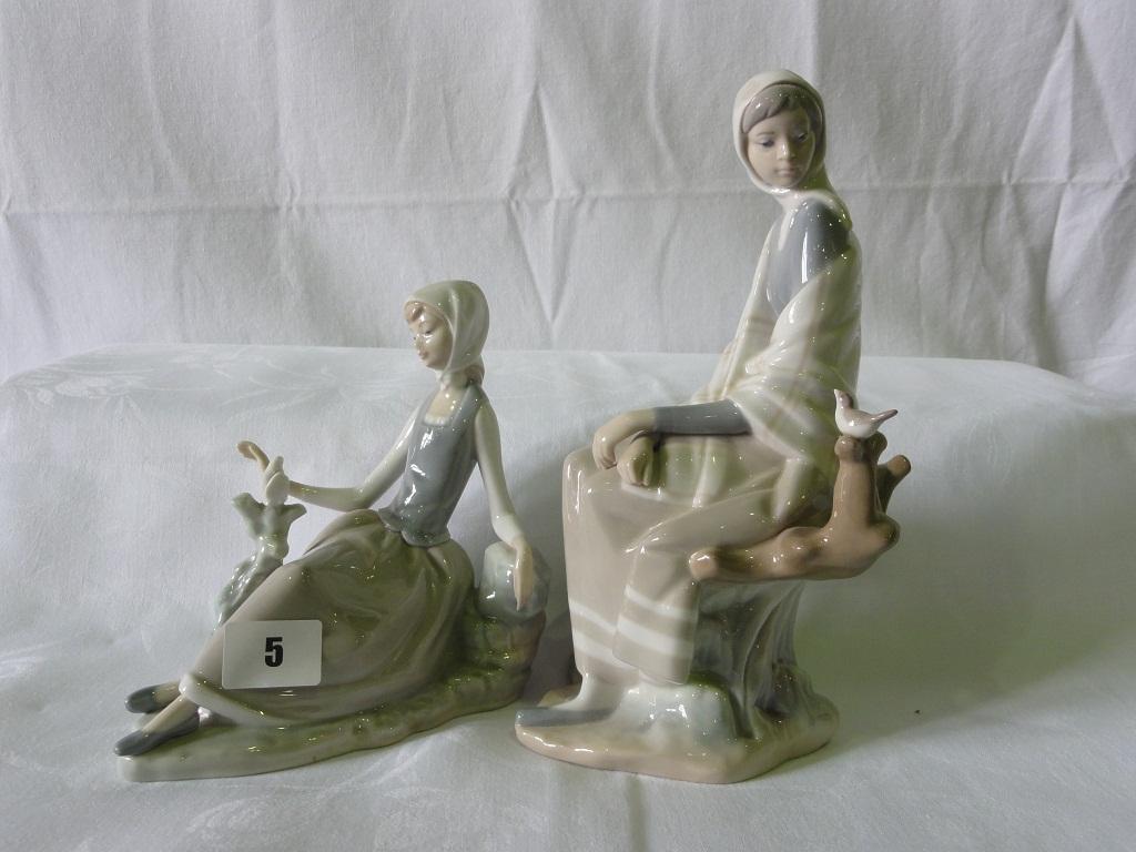 Appraisal: Two Lladro figure groups both showing girls seated besides birds