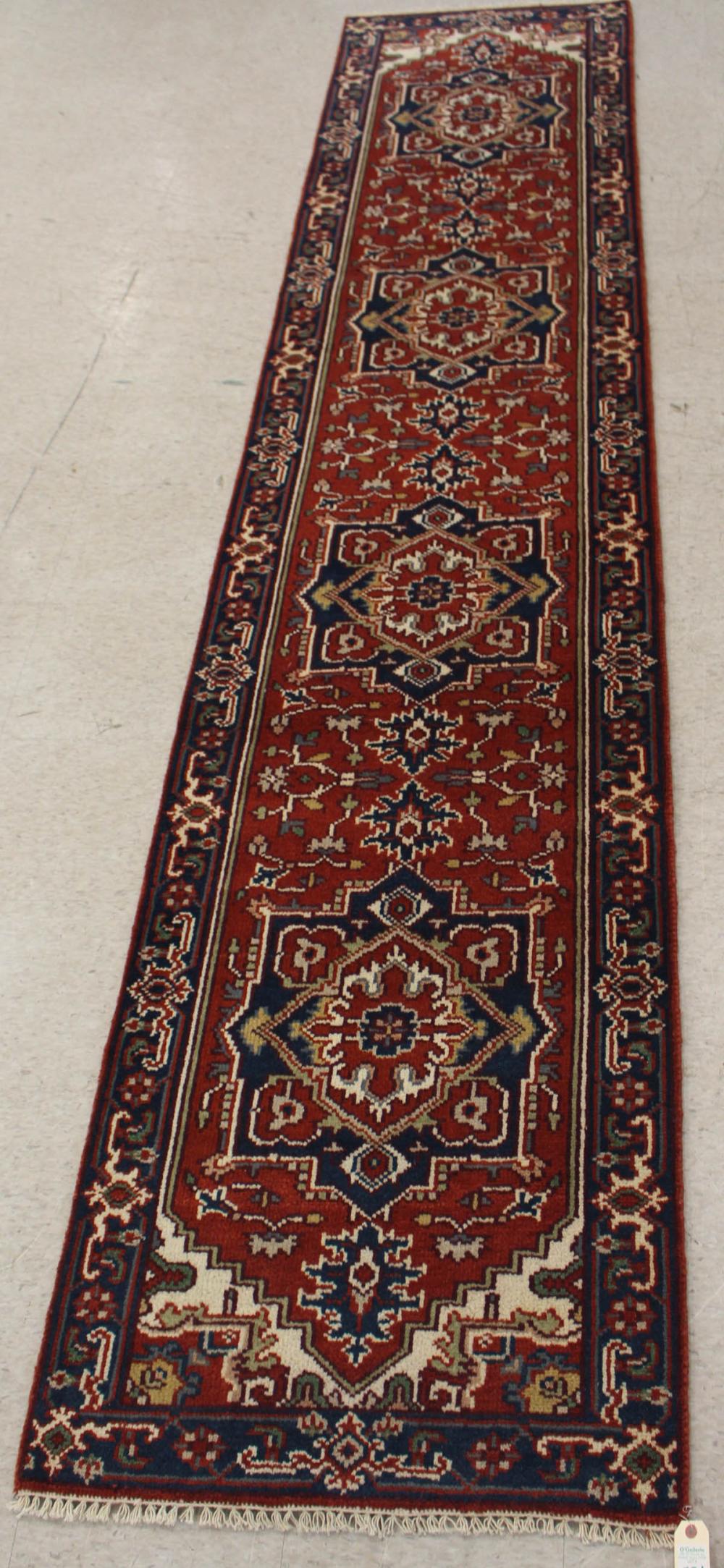 Appraisal: HAND KNOTTED ORIENTAL RUNNER Persian Serab design on red ground