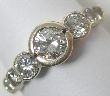 Appraisal: A modern seven-stone diamond ring semi-collet set to the front