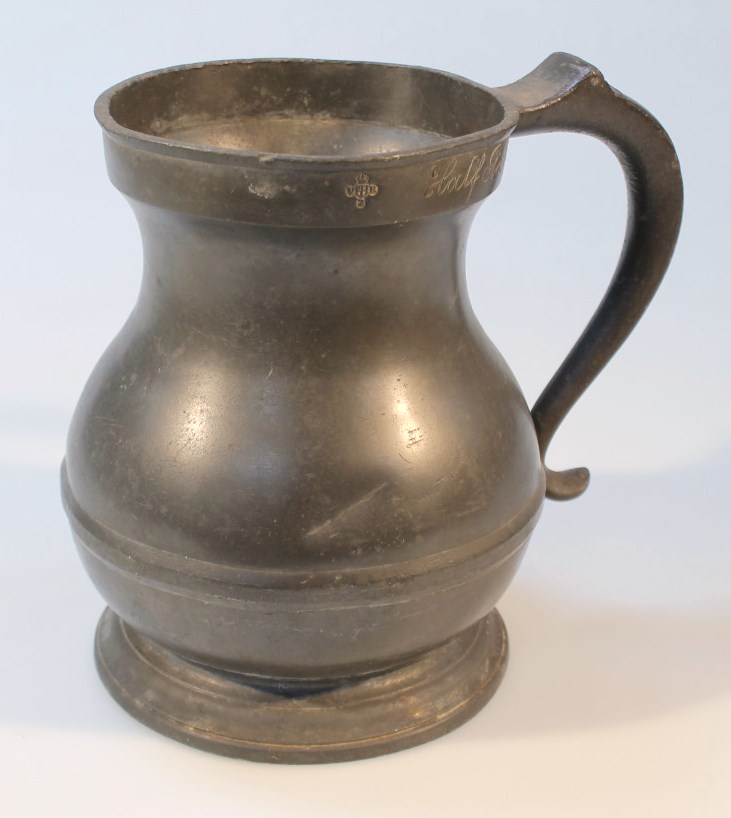 Appraisal: A thC pewter flagon the bellied body with a raised