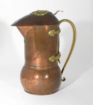 Appraisal: A brass mounted copper jug the design attributed to C