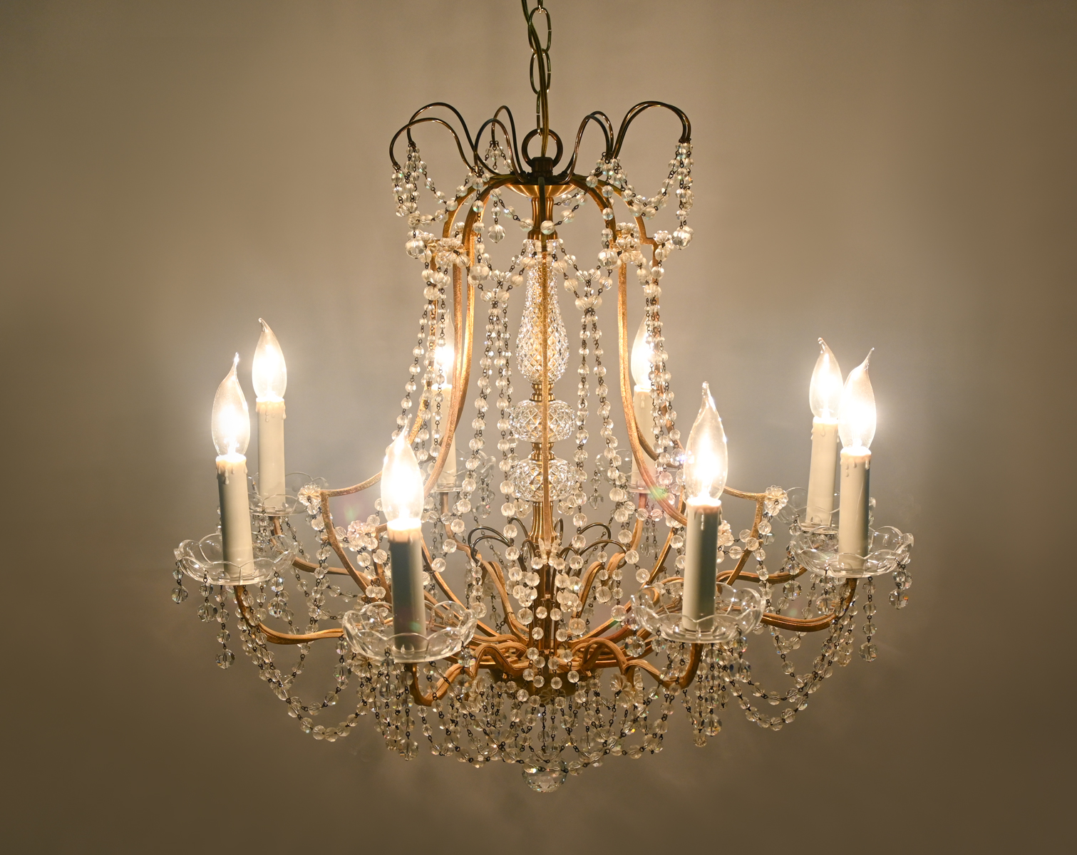 Appraisal: - LIGHT CRYSTAL CHANDELIER Gold toned metal frame with Eight