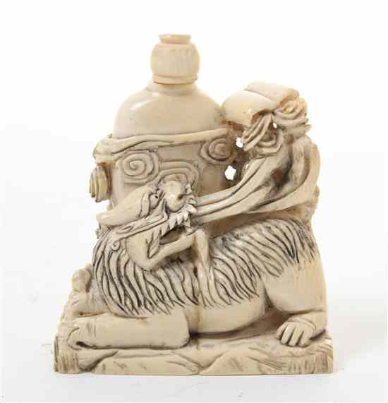 Appraisal: A Carved Ivory Snuff Bottle with a recumbent lion at