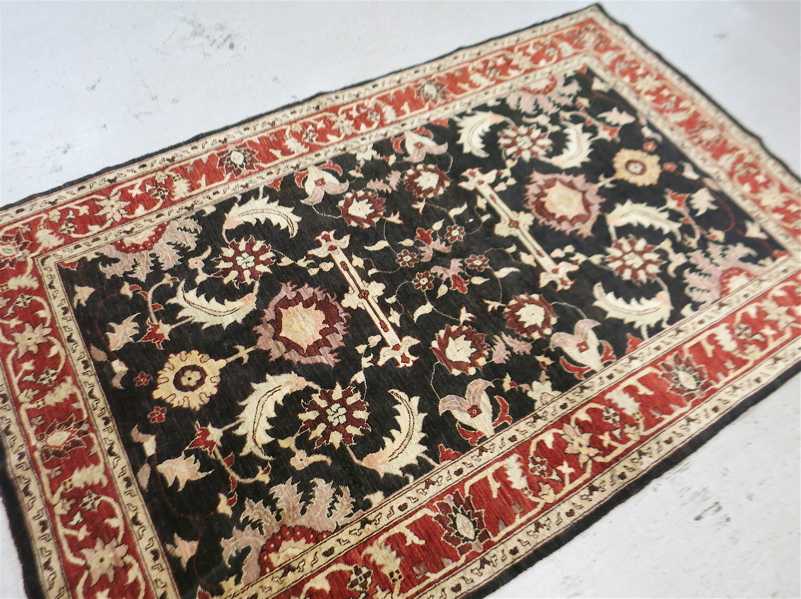 Appraisal: HAND KNOTTED ORIENTAL CARPET Pakistani Persian overall floral design on