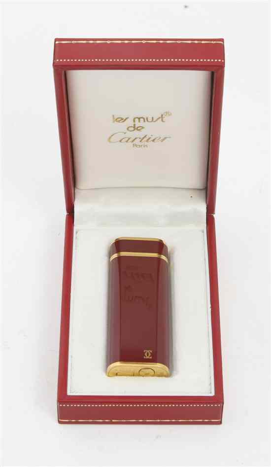 Appraisal: A French Lacquer and Gold Plated Cigarette Lighter les Must