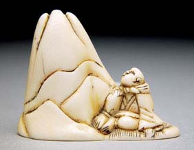 Appraisal: ANTIQUE IVORY NETSUKE Antique carved ivory netsuke of a figure