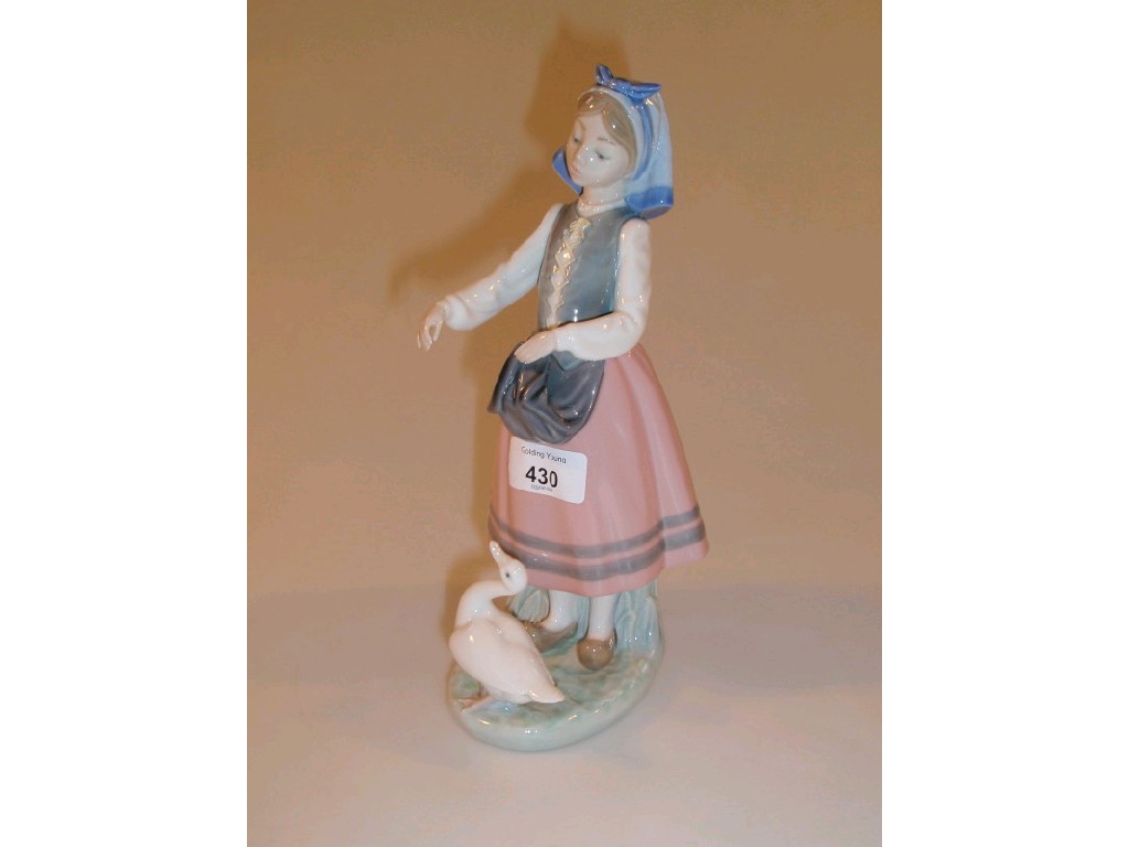 Appraisal: A Lladro figure of a goose girl and goose on