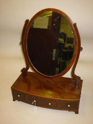 Appraisal: A VICTORIAN MAHOGANY TOILET MIRROR of bowed form with stringing