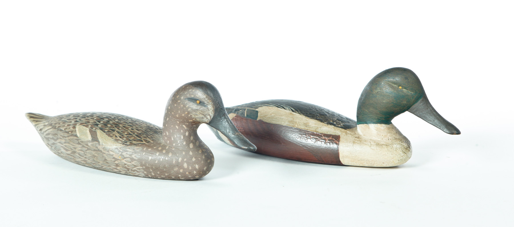 Appraisal: TWO MINIATURE DUCK DECOYS American early th century Labeled as