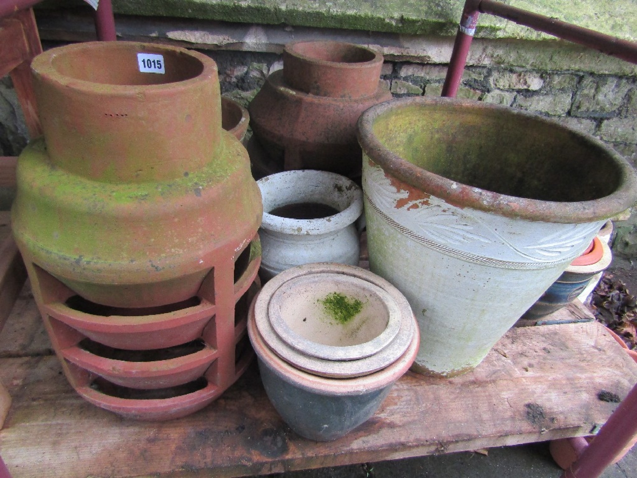 Appraisal: Two reclaimed terracotta chimney pots vented cowls together with a