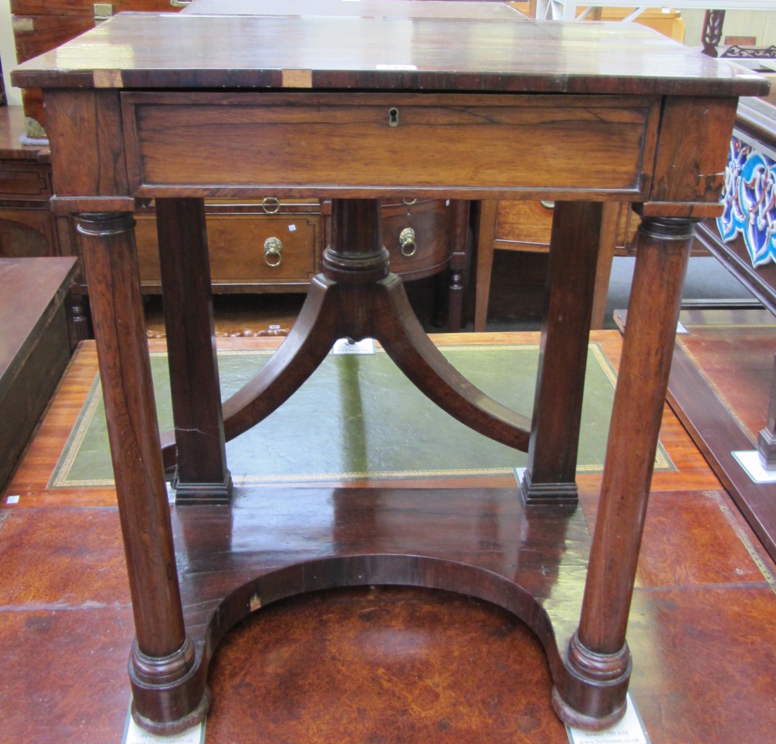 Appraisal: An early th century rosewood consel writing table with fitted