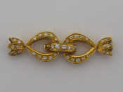 Appraisal: An carat yellow gold and diamond clasp the double loop