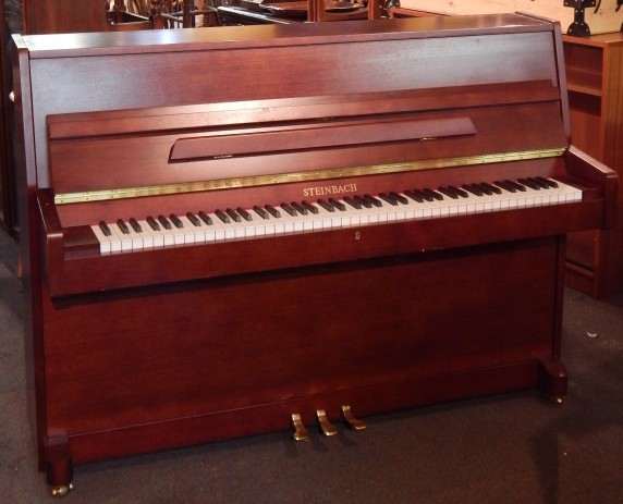 Appraisal: A Steinbach upright piano in a teak case with brass