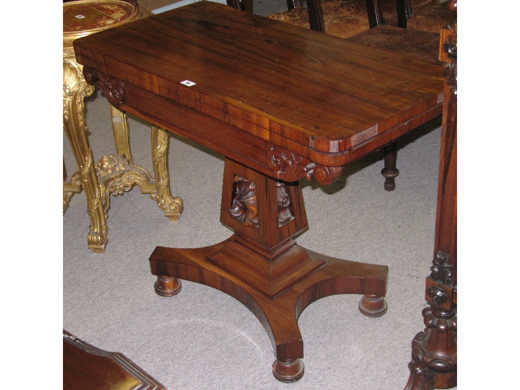 Appraisal: Nineteenth century rosewood turnover tea table with carved pedestal base