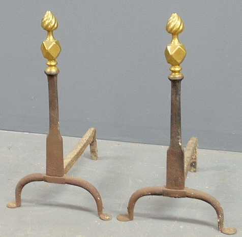 Appraisal: - Pair of cast iron andirons c with brass flame