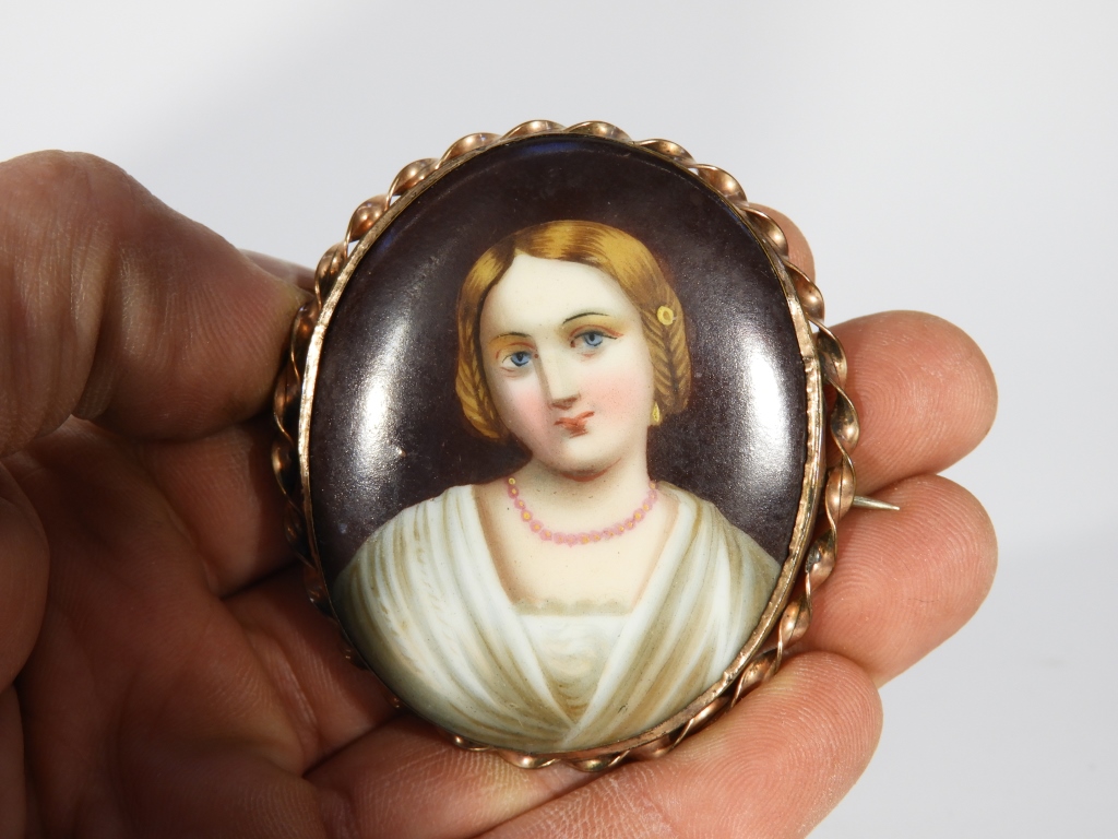 Appraisal: C GERMANY PAINTED PORCELAIN BROOCH Germany th CenturyPortrait painting of