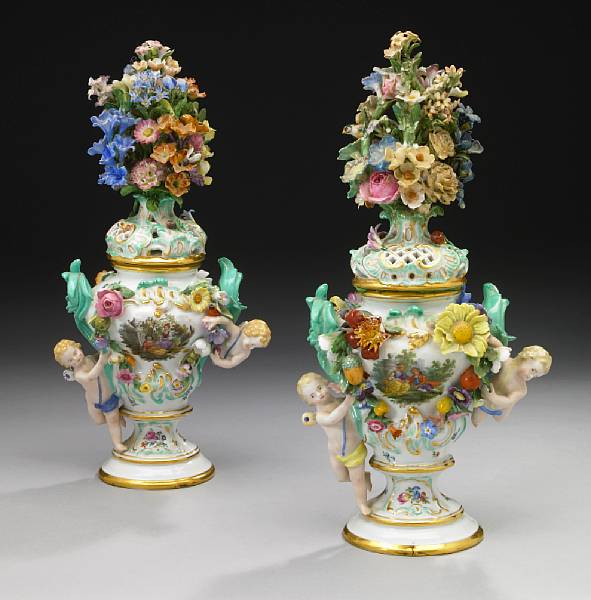 Appraisal: A pair of German porcelain covered vases Each surmounted by