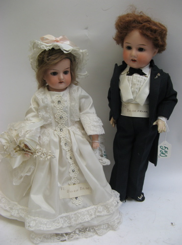 Appraisal: PAIR OF GERMAN BRIDE AND GROOM BISQUE HEAD DOLLS Armand