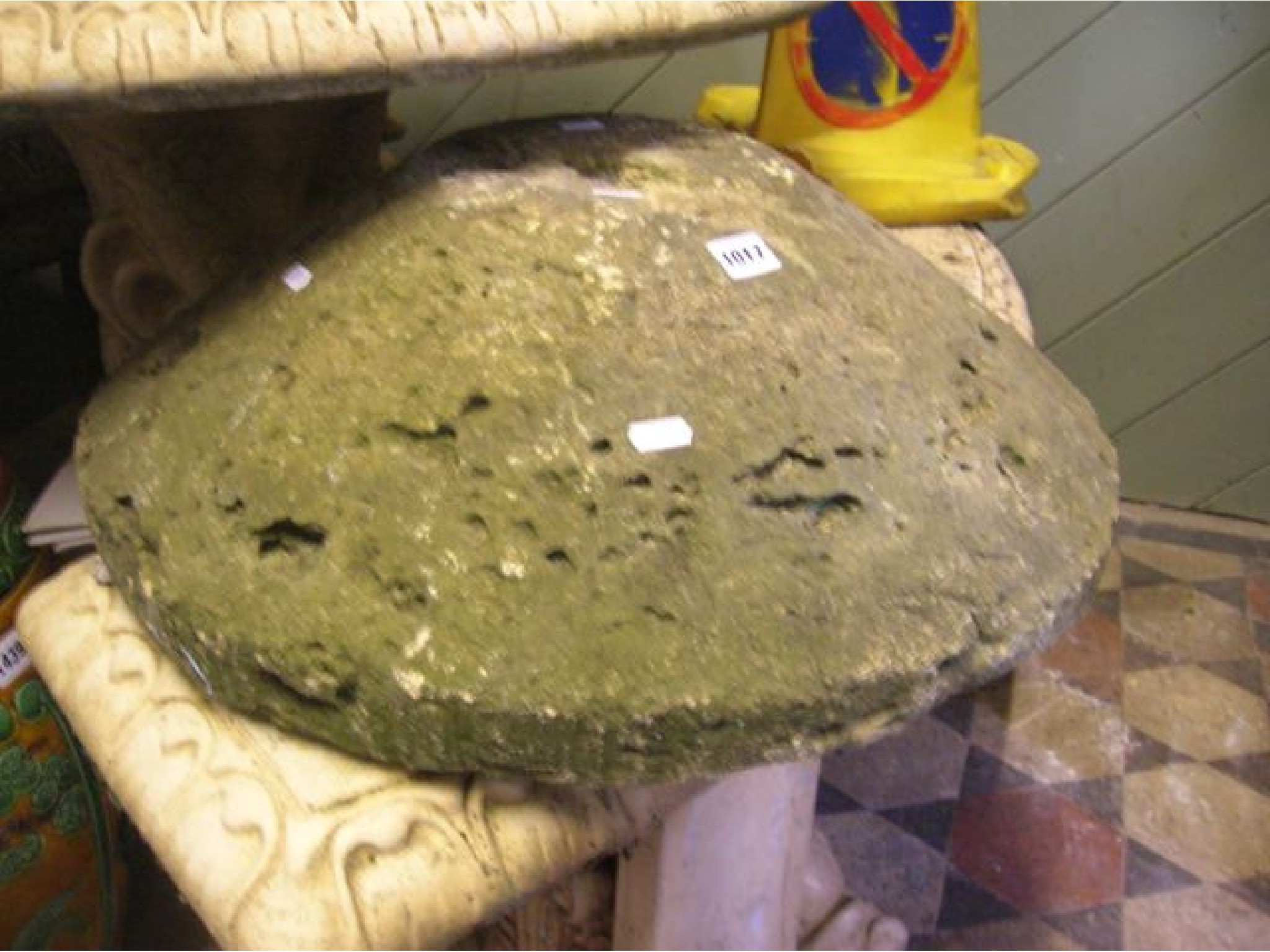 Appraisal: A weathered natural stone staddle stone cap