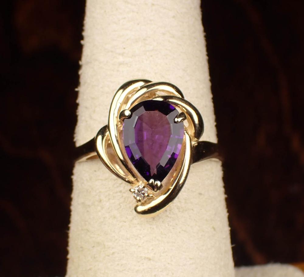 Appraisal: AMETHYST DIAMOND AND FOURTEEN KARAT GOLD RING having a mm