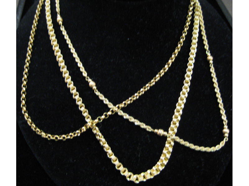 Appraisal: TRIPLE CHAIN SET Three complementary links form this triple chain