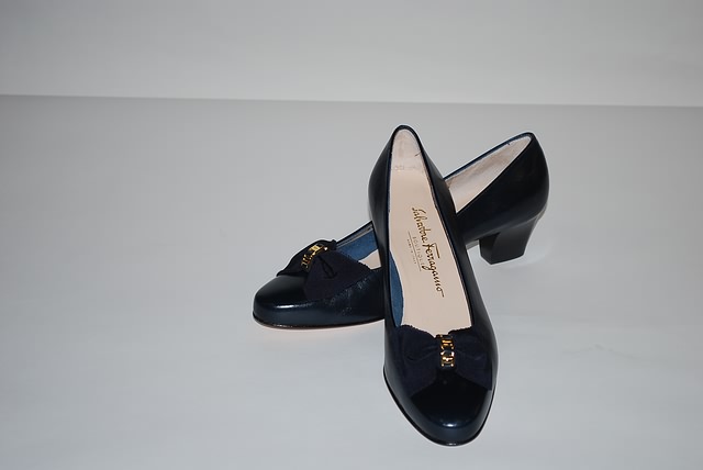 Appraisal: Salvatore Ferragamo navy calf pumps with bow Size B Price