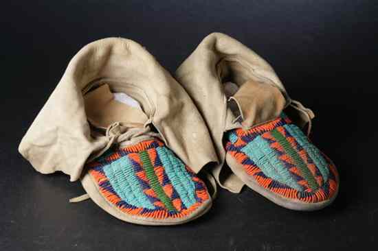 Appraisal: PAIR PLAINS BEADED BUCKSKIN MOCCASINS Early-to-mid th century Worked in