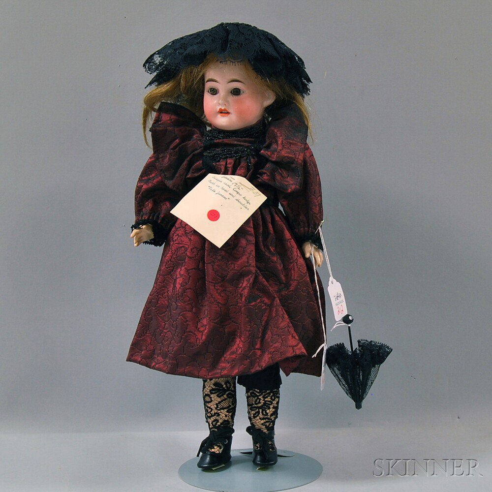 Appraisal: Bisque Head Girl Doll brown paperweight eyes open mouth upper