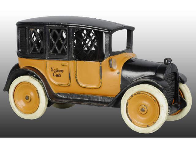 Appraisal: Cast Iron Arcade Yellow Cab Still Bank Description Rubber tire