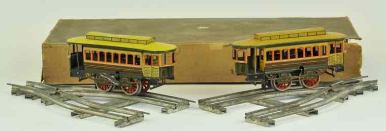 Appraisal: BOXED BING TROLLEY CARS WITH TRACK This pair of trolleys