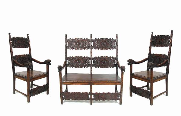 Appraisal: A Renaissance style carved walnut three piece suite of seat