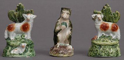 Appraisal: PAIR OF STAFFORDSHIRE SHEEP AND A MONKEY The pair an