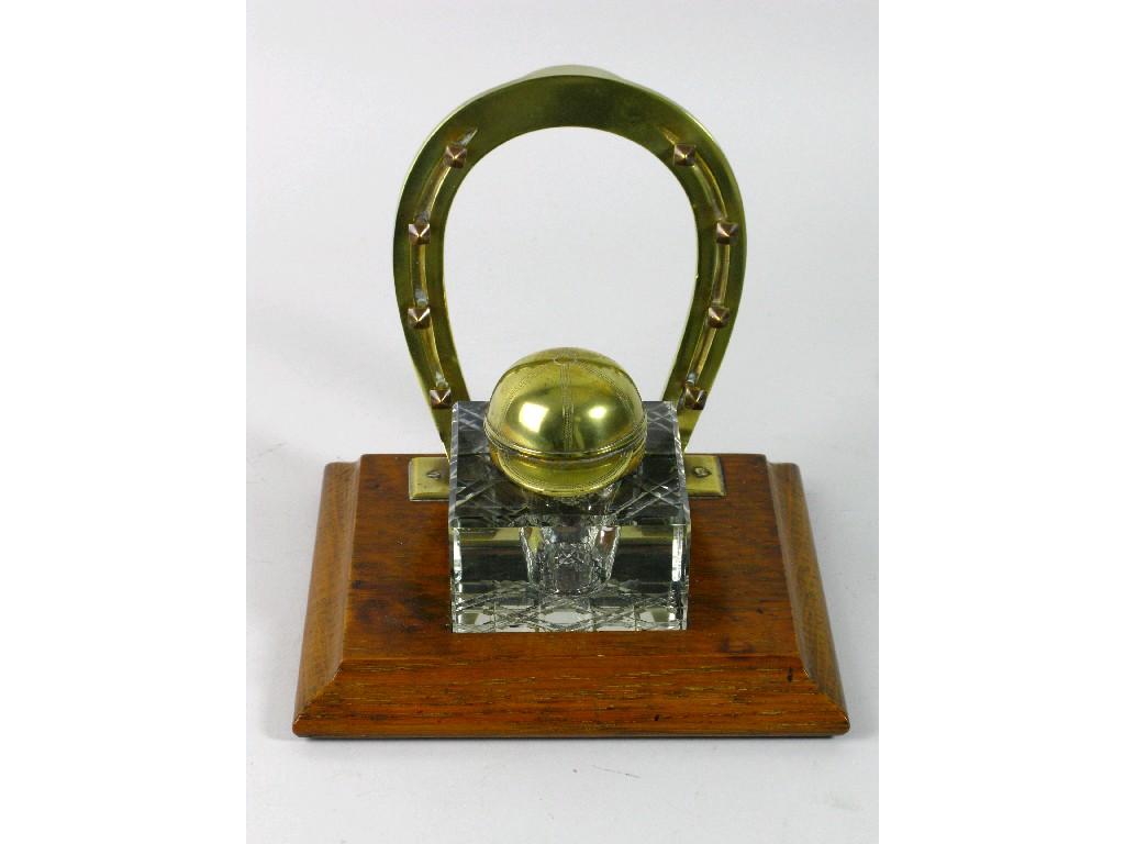 Appraisal: An Edwardian Inkwell with brass horseshoe pen rack and jockey