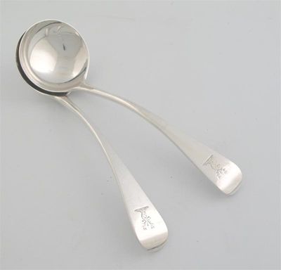 Appraisal: A pair of sauce ladles Old English pattern crested by