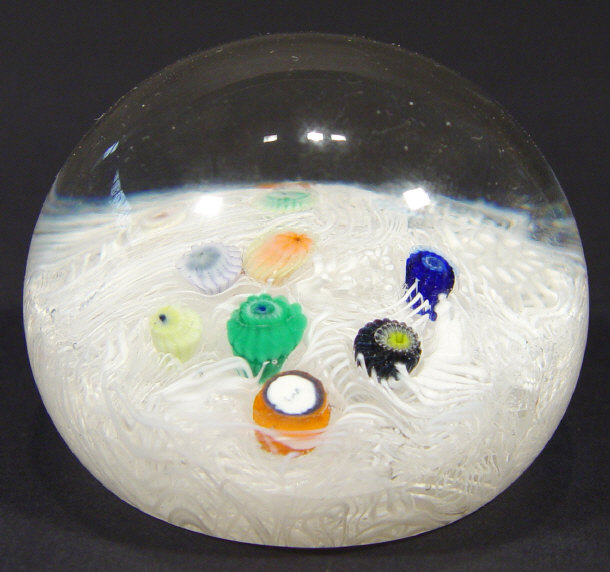 Appraisal: Clear domed glass paperweight with white trailled decoration and millefiore