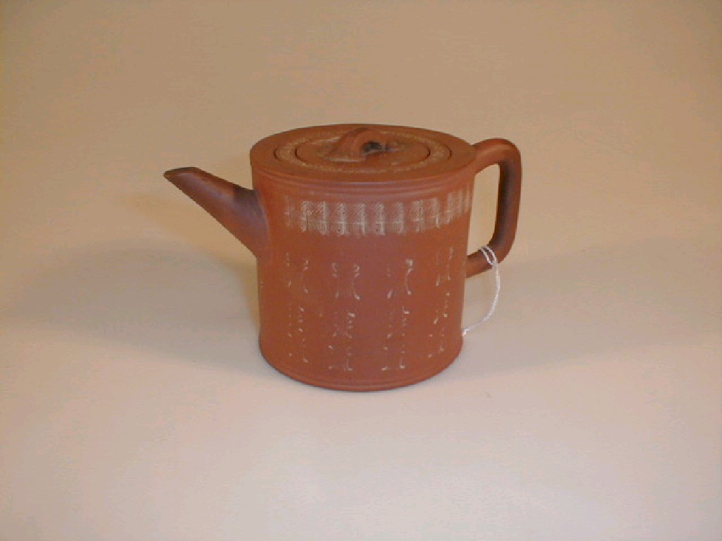 Appraisal: A thC Chinese redware teapot with liner and cover