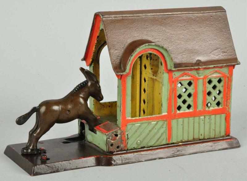 Appraisal: Cast Iron Mule Entering Barn Mechanical Bank Description Manufactured by