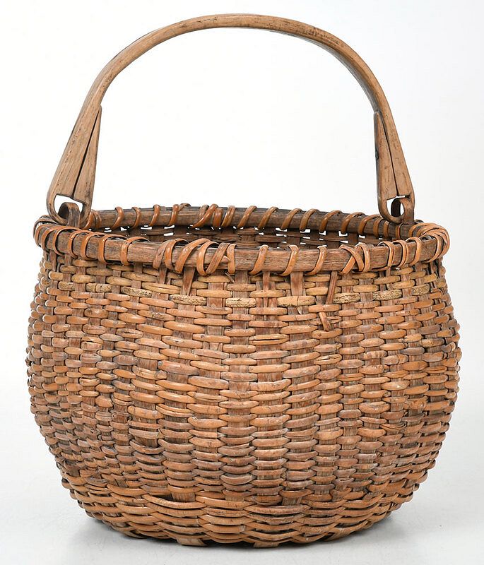 Appraisal: Wicker Basket with Bail Handle American th century round woven