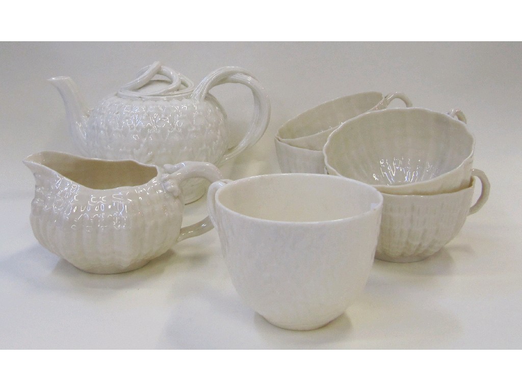 Appraisal: Four Belleek shell cups and a sugar bowl an Artichoke