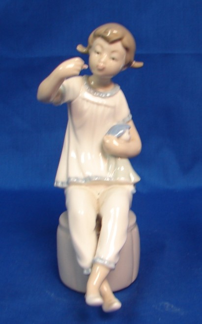 Appraisal: Girl With Doll - Retired Good Condition U S S