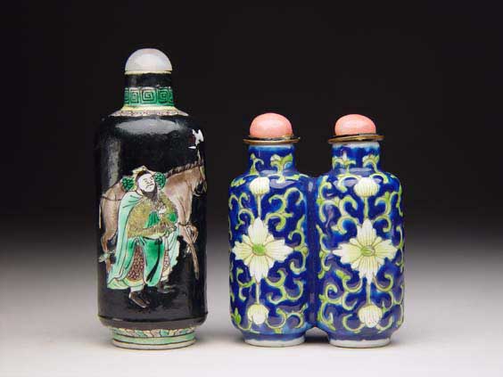 Appraisal: TWO PORCELAIN SNUFF BOTTLES Two antique enameled porcelain snuff bottles