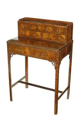 Appraisal: A mahogany bonheur du jour retailed by Maple Co with