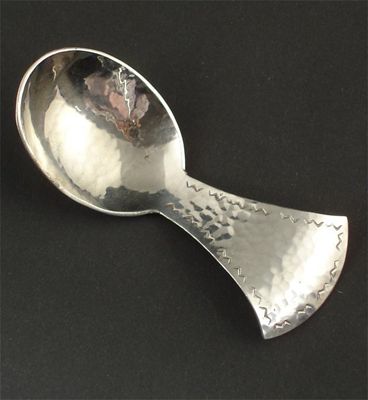 Appraisal: A Keswick School of Industrial Arts hammered metal caddy spoon