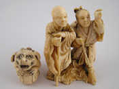 Appraisal: A carved ivory group of a peasant woman directing a