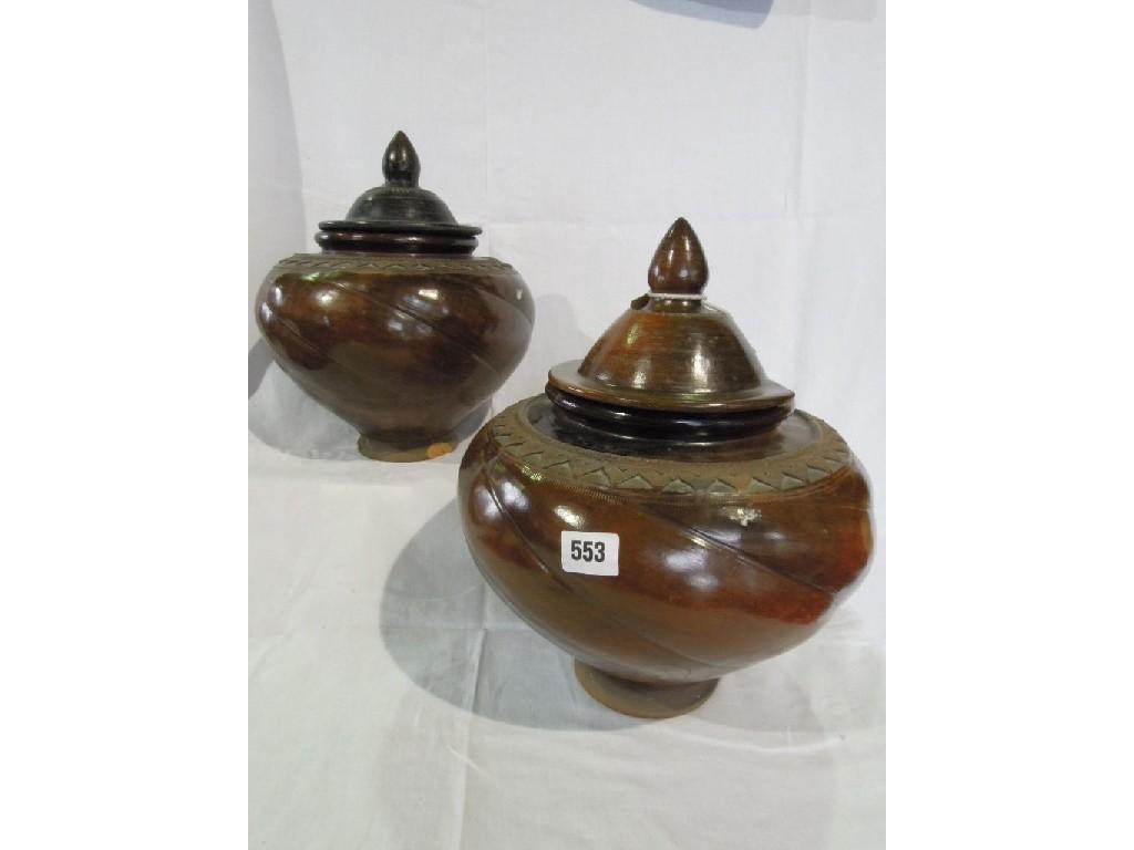 Appraisal: A pair of South East Asian earthenware jars in a