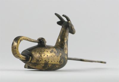 Appraisal: A Middle Eastern brass padlock cast as a wide eyed