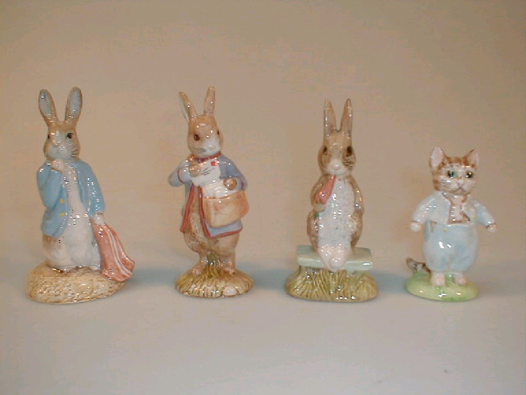 Appraisal: Four Royal Albert Beatrix Potter figures Peter with Postbag Peter